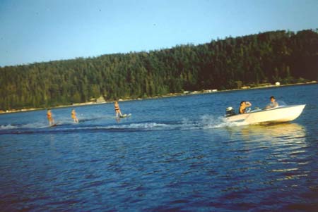 Three Waterskiers behind the Sande Ace